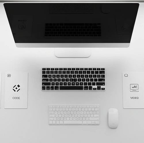 An organized desk with categorized AI tool cards representing different AI use cases in 2025